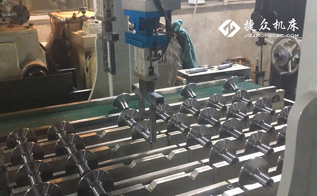 上下料運(yùn)機(jī)器人,無(wú)心磨床磨脫水軸套(圖1) 上下料運(yùn)機(jī)器人